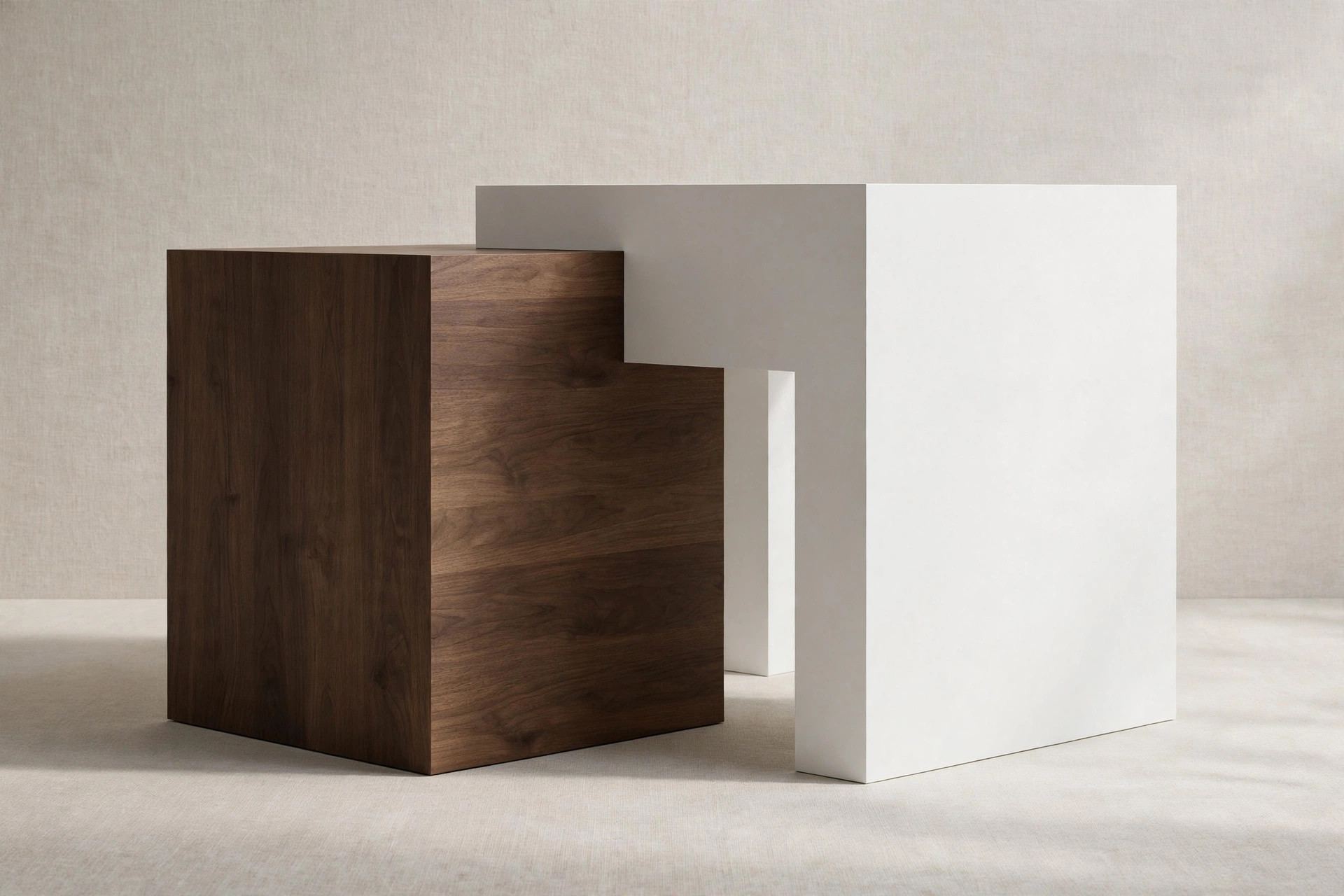 Architectural form study composed of interlocking white and dark wood volumes